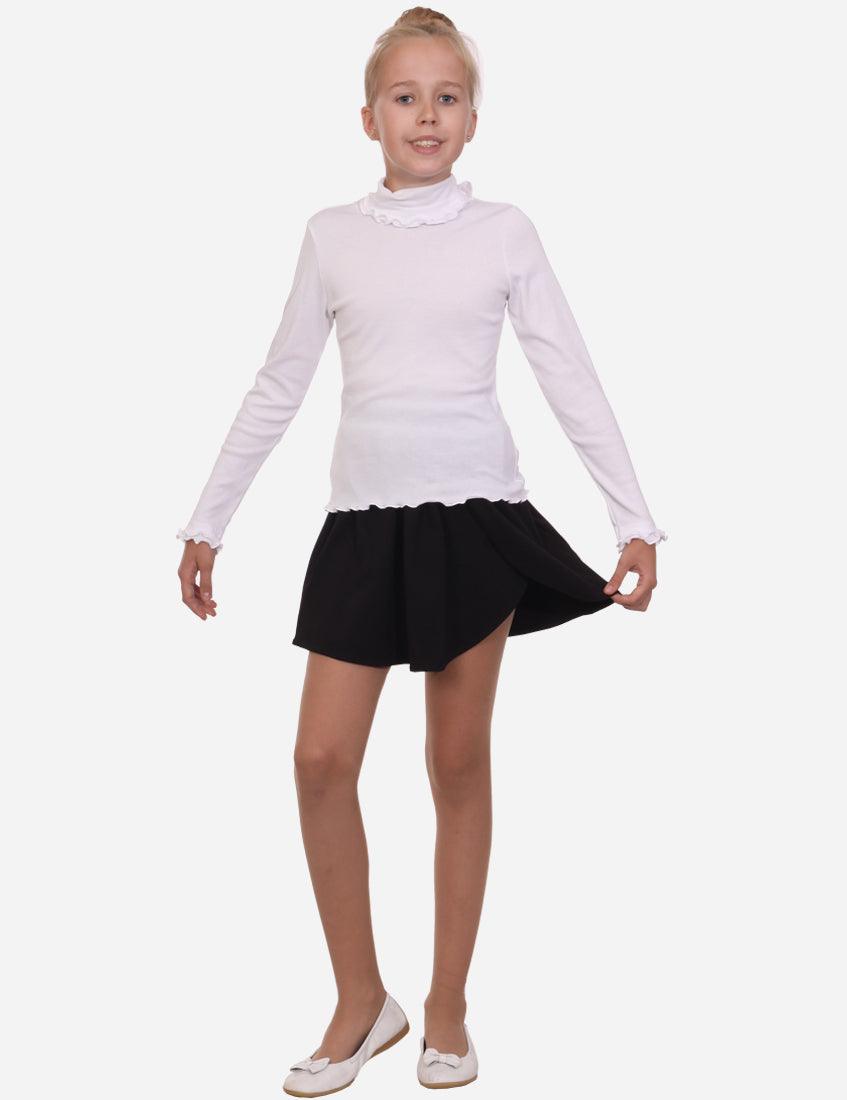 Back view of a young girl in a pleated black skirt with slit and white turtleneck, wearing white ballet flats, isolated on white background.