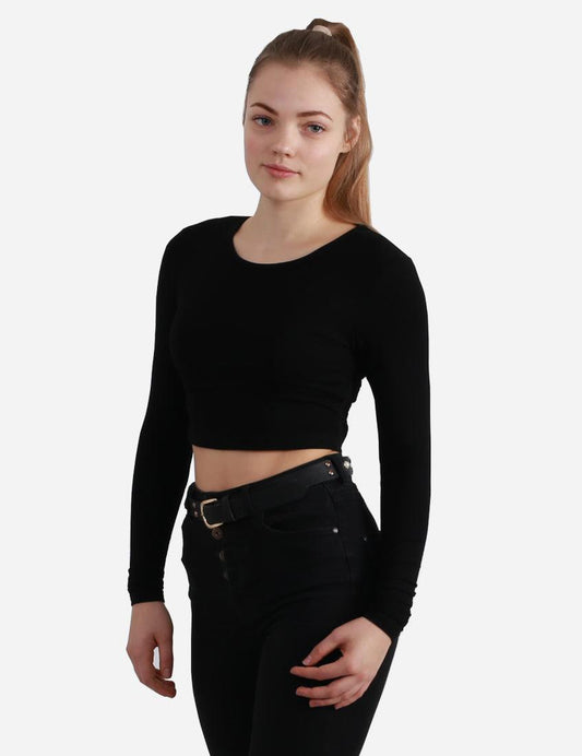 Woman in black long sleeve cropped top facing forward on white background