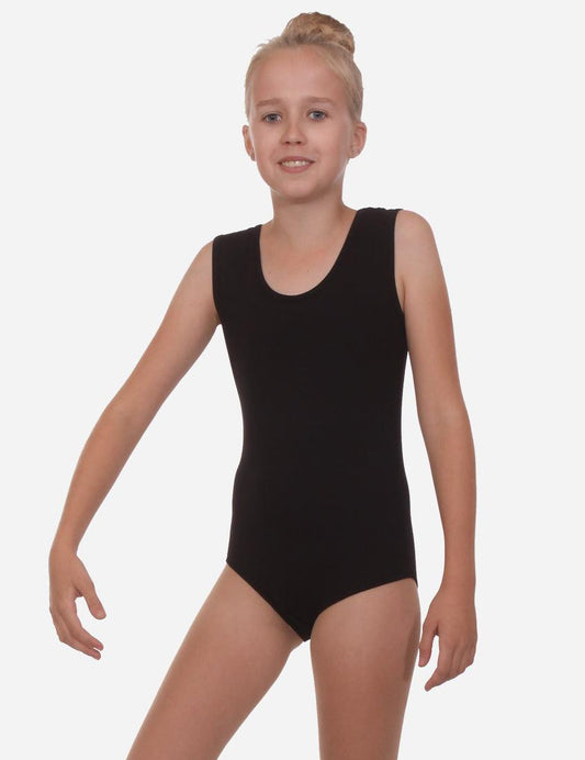 Child gymnast smiling in a sleeveless black leotard, ready for a performance.