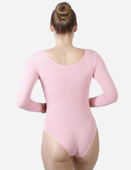 Female ballet dancer in pink half-sleeve leotard with hair bun viewed from the back