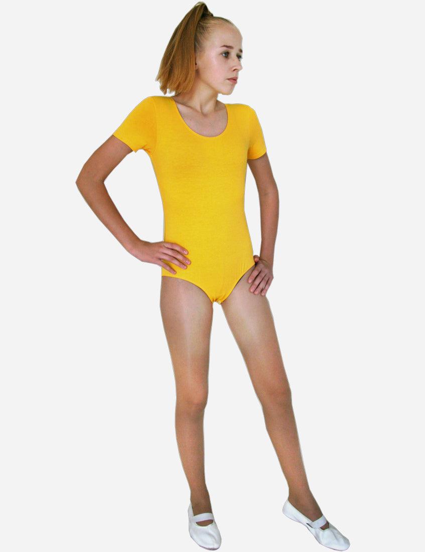 Side view of a young female gymnast in a vibrant yellow leotard with short sleeves, white background.