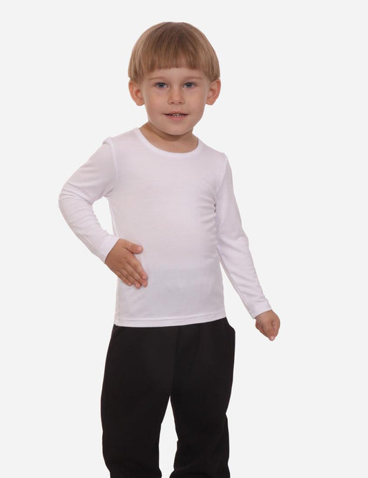 Little boy in a white long sleeve shirt and black pants standing front view on white background